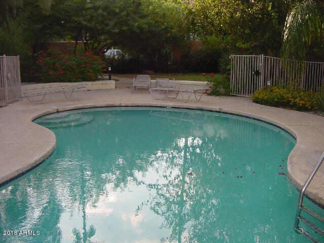 1018 East Osborn Road, Unit B Phoenix, AZ 85014 - Photo 7 of 7 a view of a water pond with green yard