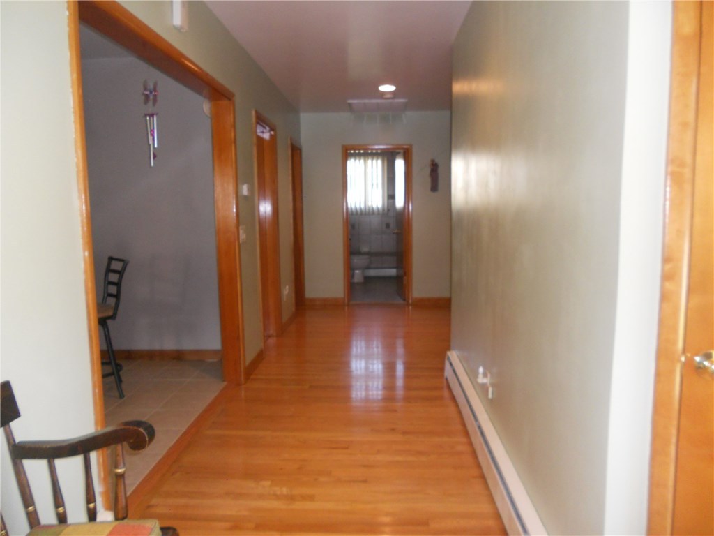 12 Lawrence Road North Providence, RI 02911 - Photo 11 of 40 24 FOOT LONG-OAK HARDWOOD HALLWAY OFF FOYER ENTRANCE TO SUNKEN LIVING ROOM, KITCHEN, 3 BEDROOMS AND BATHROOM