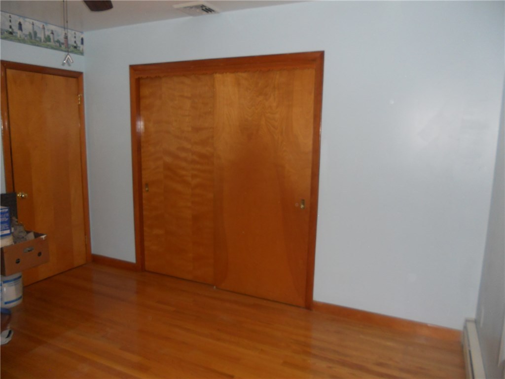 12 Lawrence Road North Providence, RI 02911 - Photo 18 of 40 2ND BEDROOM 12 + 1/2 X 11 + 1/2, FEATURING ALL OAK HARDWOOD FLOORING, CASEMENT WINDOWS, AND CEILING FAN{CLOSET LENGTH 7 + 1/2 FEET}