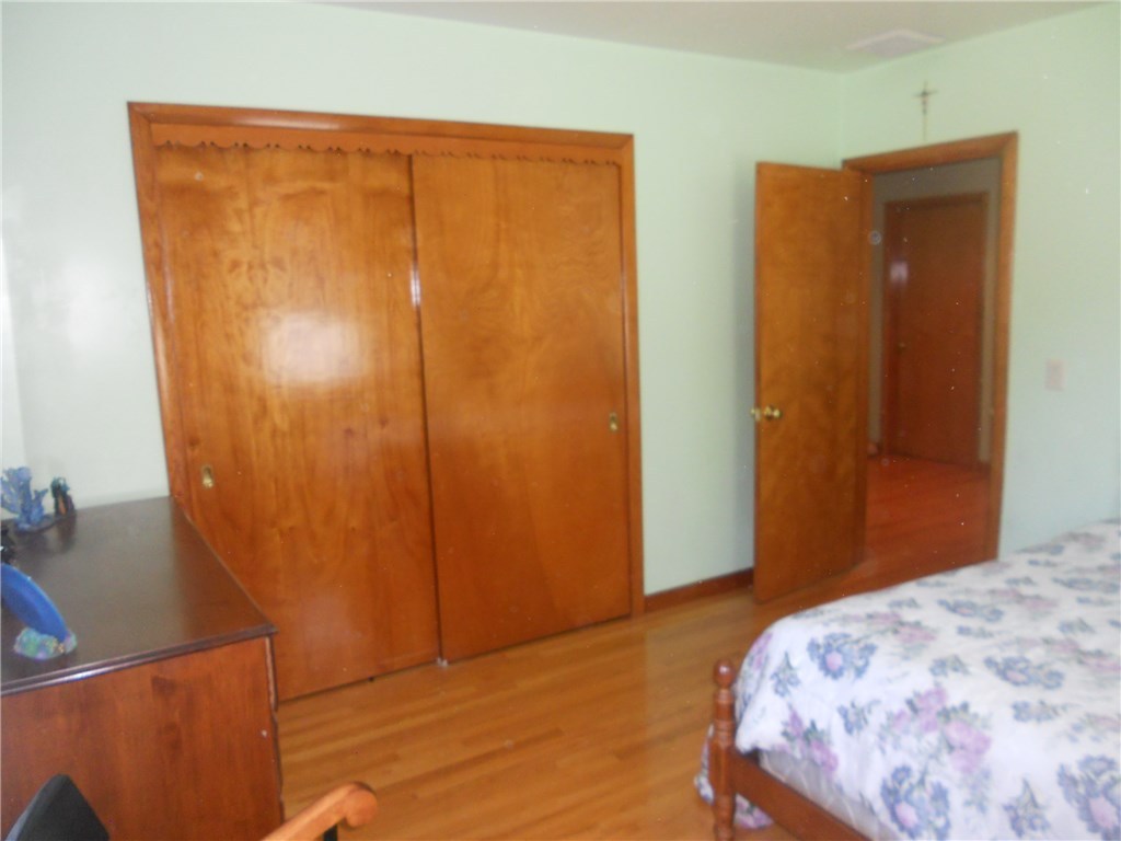 12 Lawrence Road North Providence, RI 02911 - Photo 20 of 40 12+1/2 x 11+1/2 FOOT BEDROOM . CLOSET =10+1/4 FEET LONG CASEMENT WINDOWS, OAK HARDWOOD FLOORING