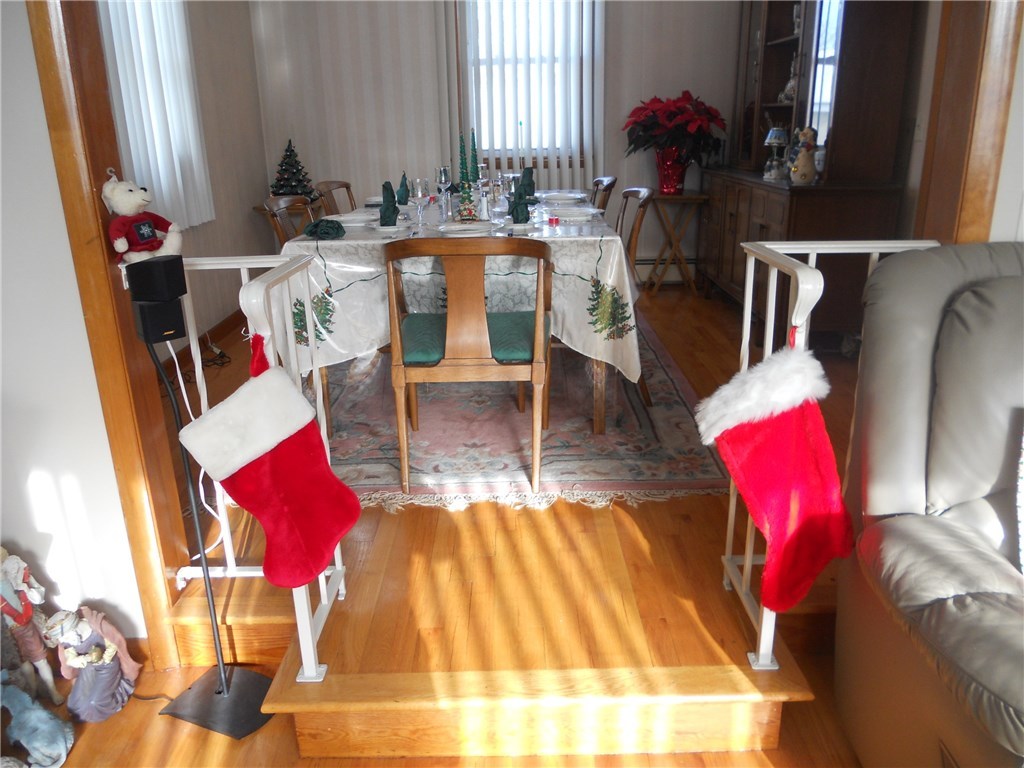 12 Lawrence Road North Providence, RI 02911 - Photo 27 of 40 VIEW FROM SUNKEN LIVING ROOM OF 12+1/2 FOOT X 11+1/2 FOOT FORMAL DINING ROOM-SEATS 8 COMFORTABLY.