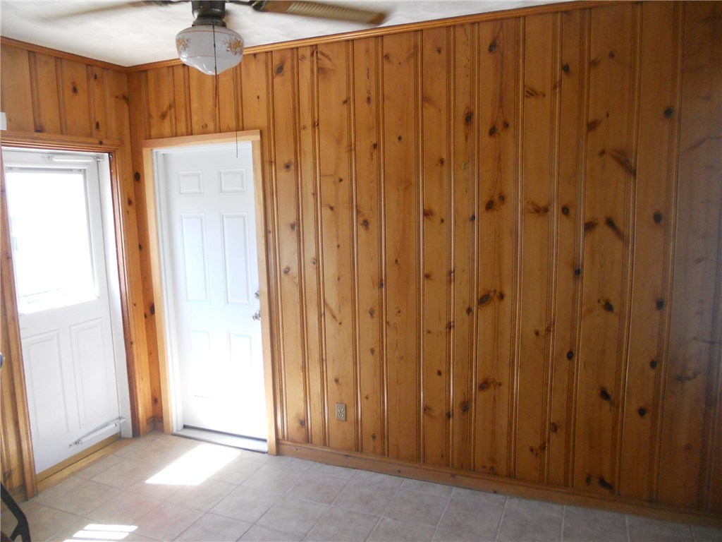 12 Lawrence Road North Providence, RI 02911 - Photo 36 of 40 13 X 10 BREZZWAY w/ AC HAS 4 ENTRANCES, kitchen, REAR YARD, GARAGE AND DRIVEWAY