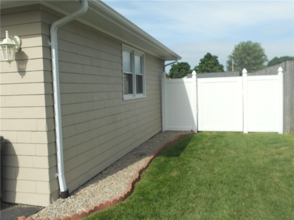 12 Lawrence Road North Providence, RI 02911 - Photo 8 of 40 GARAGE VIEW OF 2ND SIDE LOCKING GATE, DRIVE THRU WITH YOUR LAWNMOWER