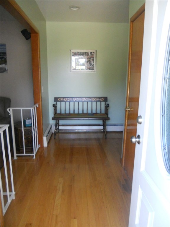 12 Lawrence Road North Providence, RI 02911 - Photo 10 of 40 FRONT DOOR ENTRY FOYER VIEW WITH RECESSED LIGHTING, THE SPACE IS BIG ENOUGH WHERE THE DEACONS BENCH IS, THAT WHEN THE HOUSE WAS BOUGHT THERE WAS A PIANO.