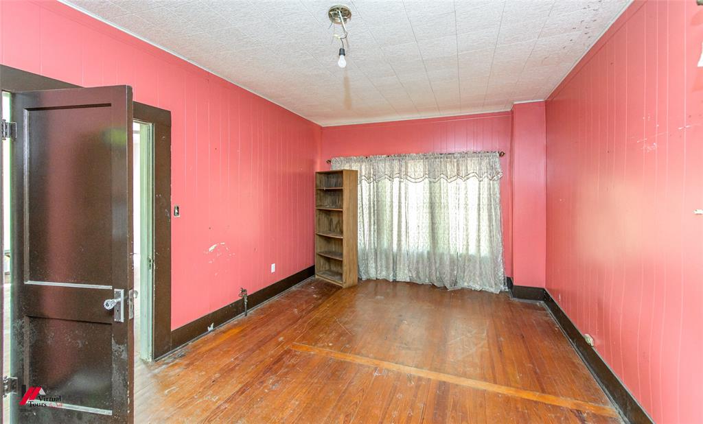179 Daniel Thomas Road Springhill, LA 71075 - Photo 13 of 37 Spare room featuring baseboards and hardwood / wood-style floors