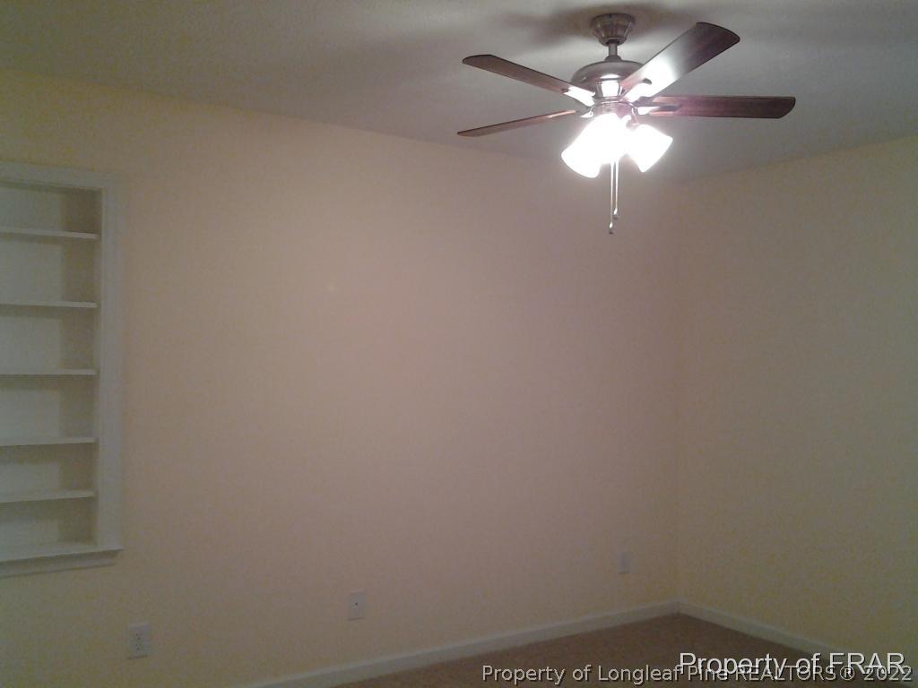 5074 Summer Ridge Road Fayetteville, NC 28303 - Photo 10 of 14 a view of a chandelier fan and window