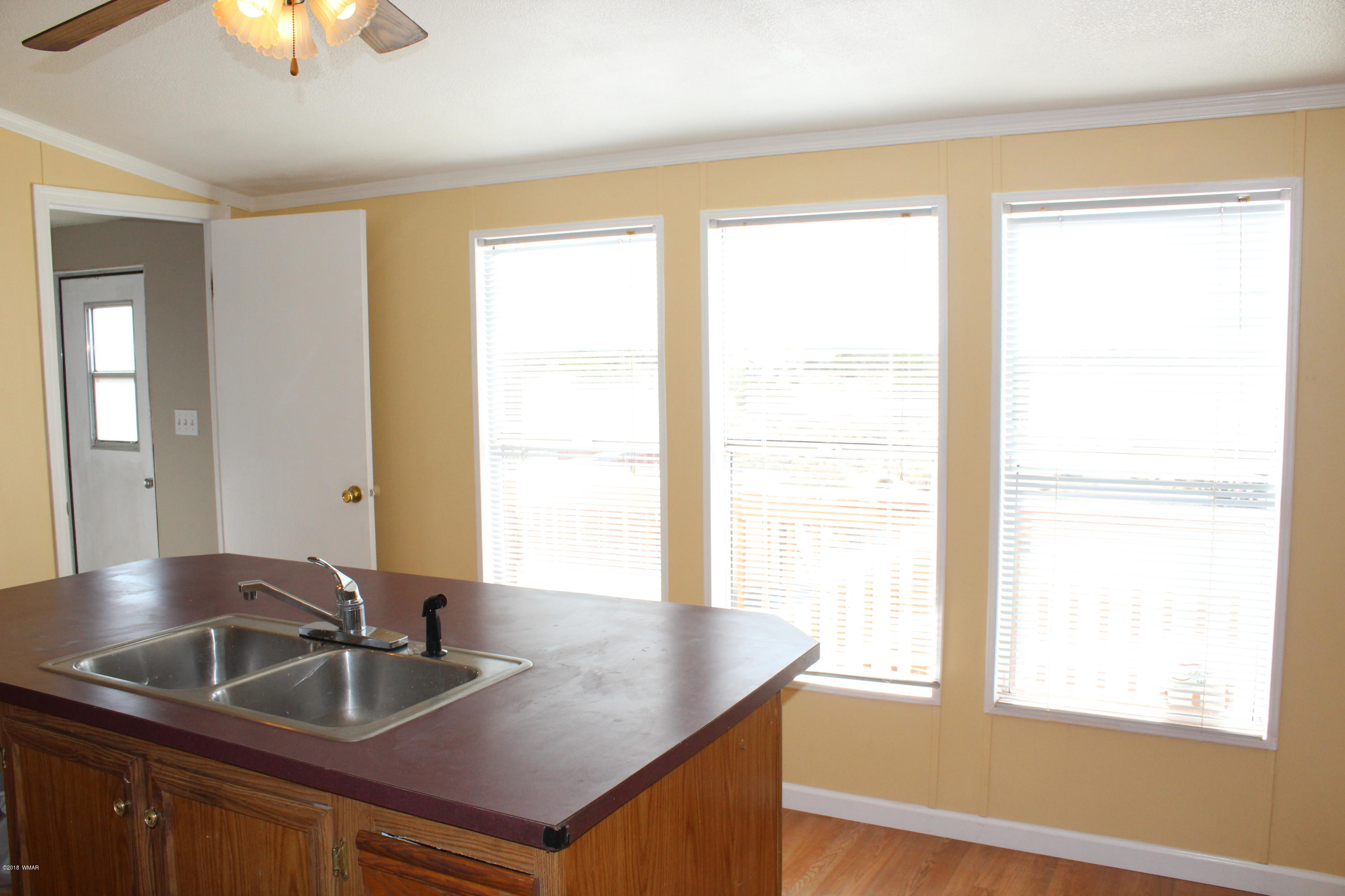 4714 Valley Road Snowflake, AZ 85937 - Photo 12 of 27 a kitchen with granite countertop a sink and a window