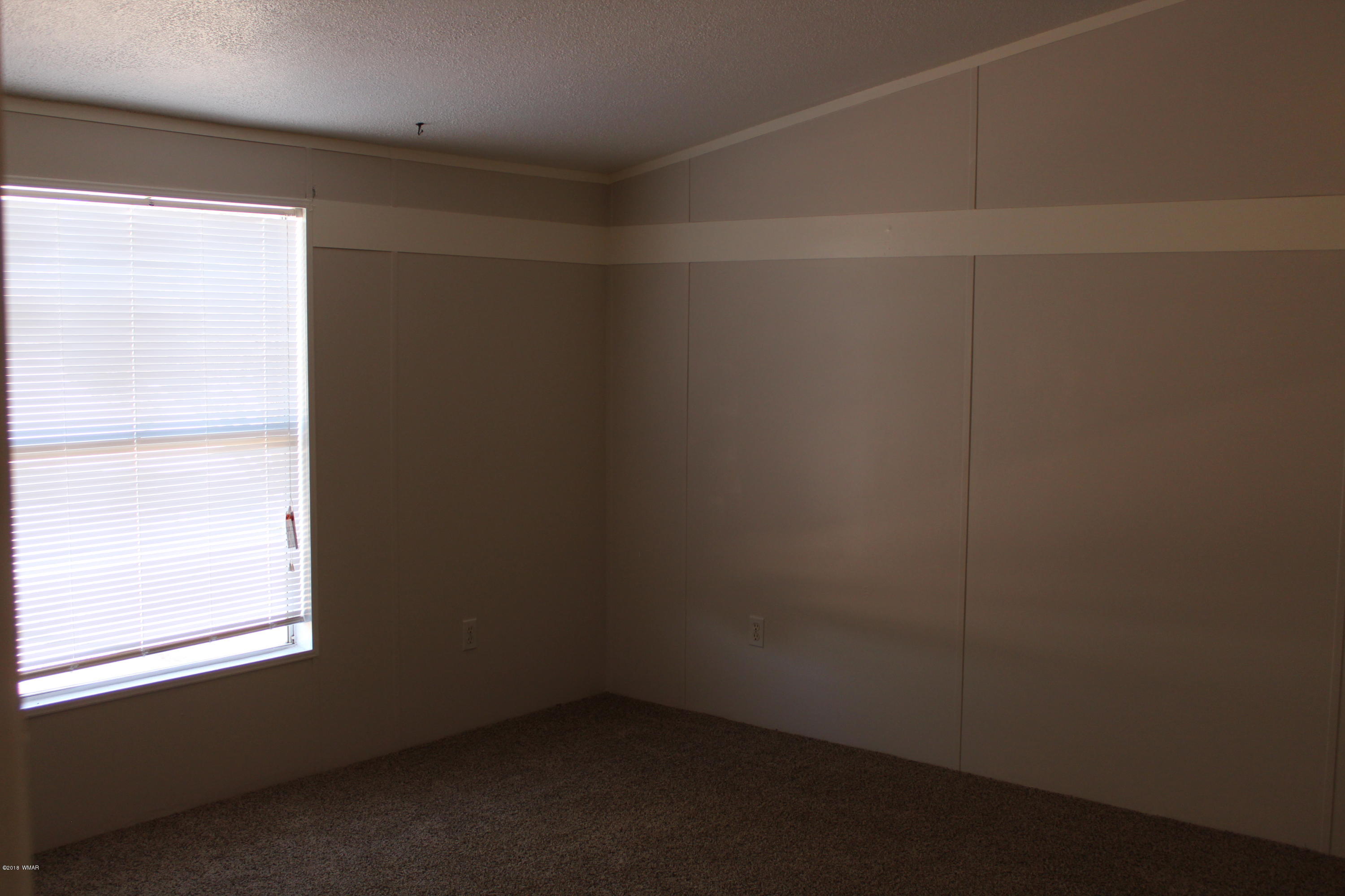 4714 Valley Road Snowflake, AZ 85937 - Photo 14 of 27 an empty room with a window