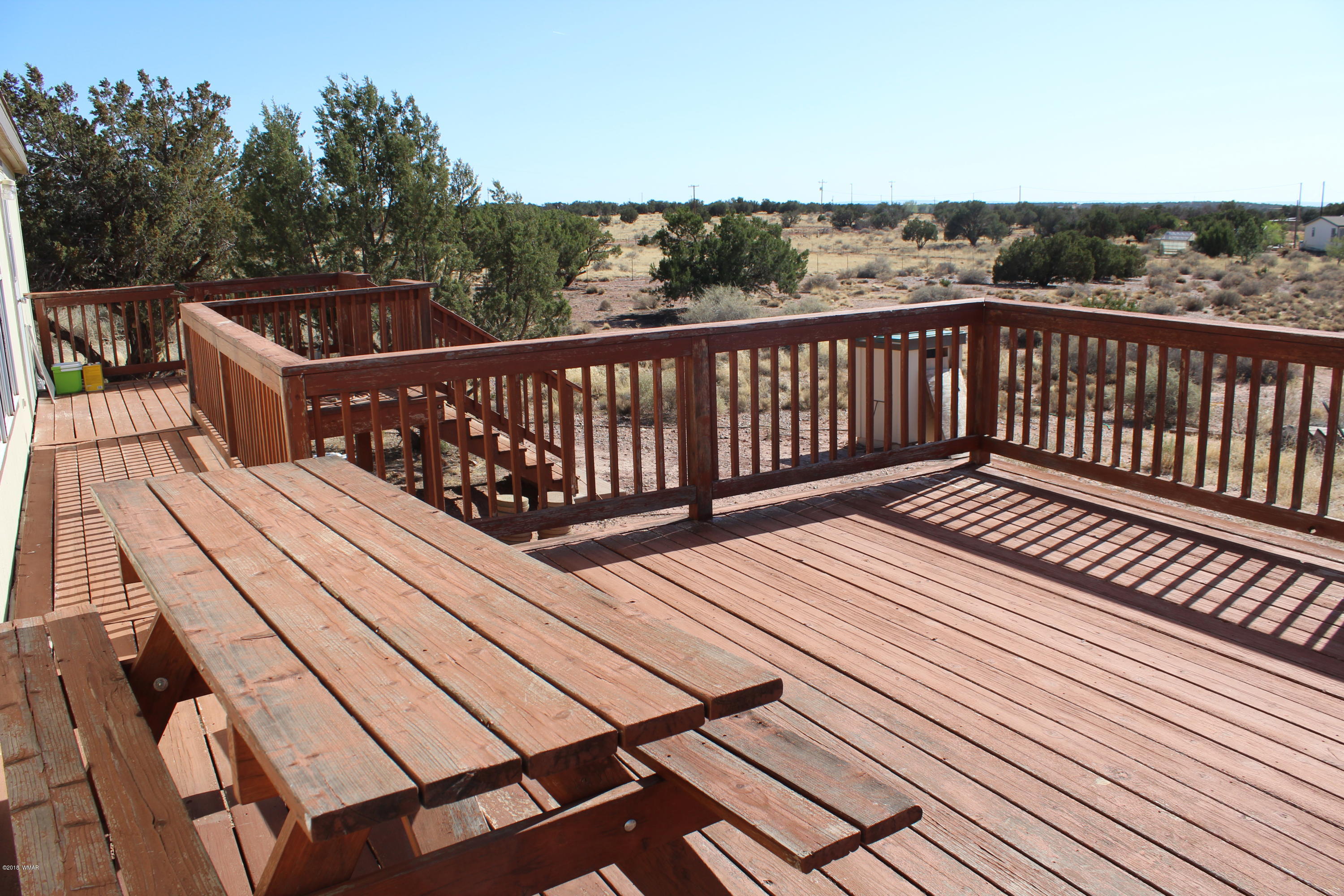 4714 Valley Road Snowflake, AZ 85937 - Photo 3 of 27 a view of balcony with wooden floor and fence