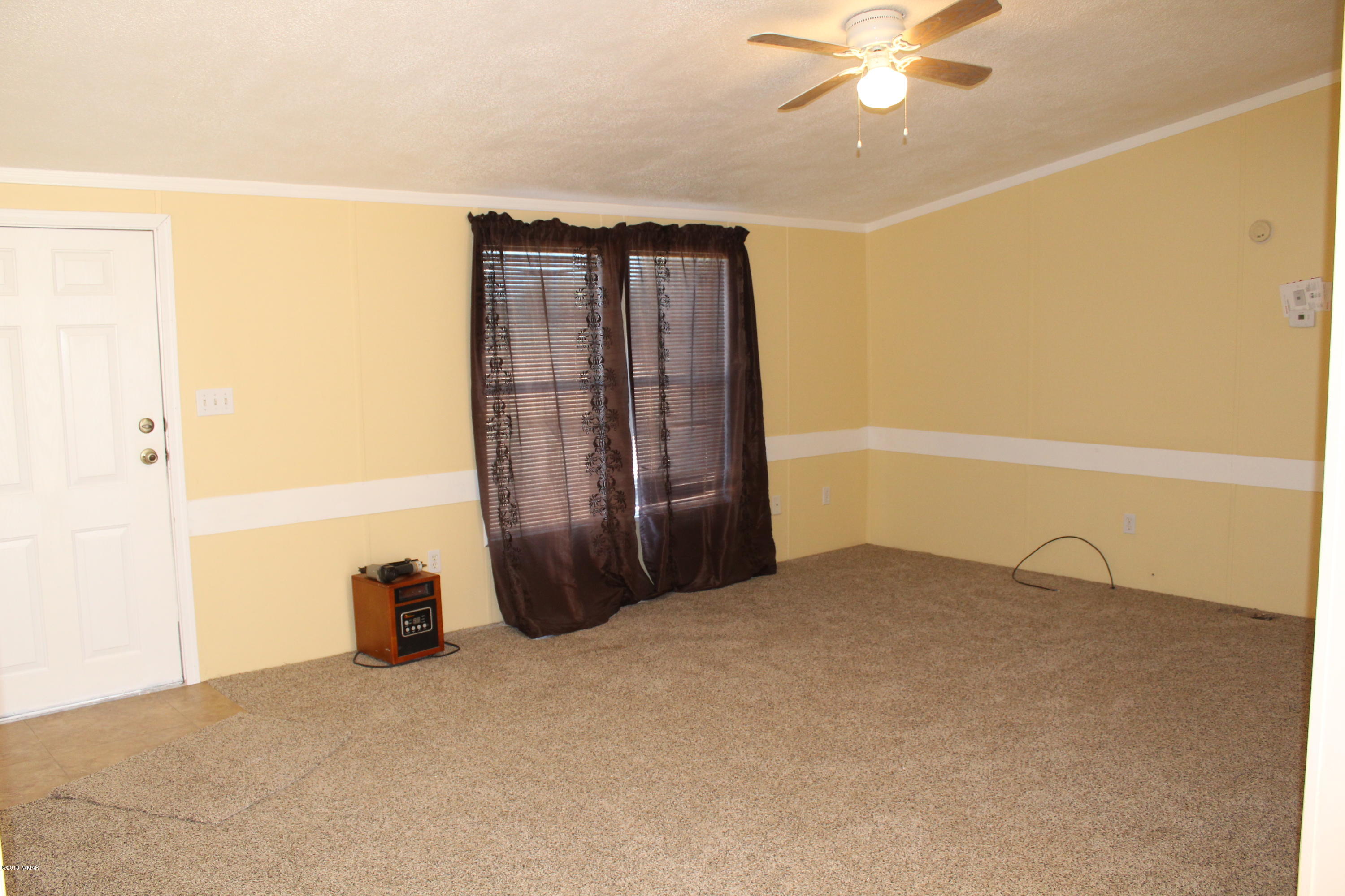 4714 Valley Road Snowflake, AZ 85937 - Photo 7 of 27 a view of an empty room with a ceiling fan