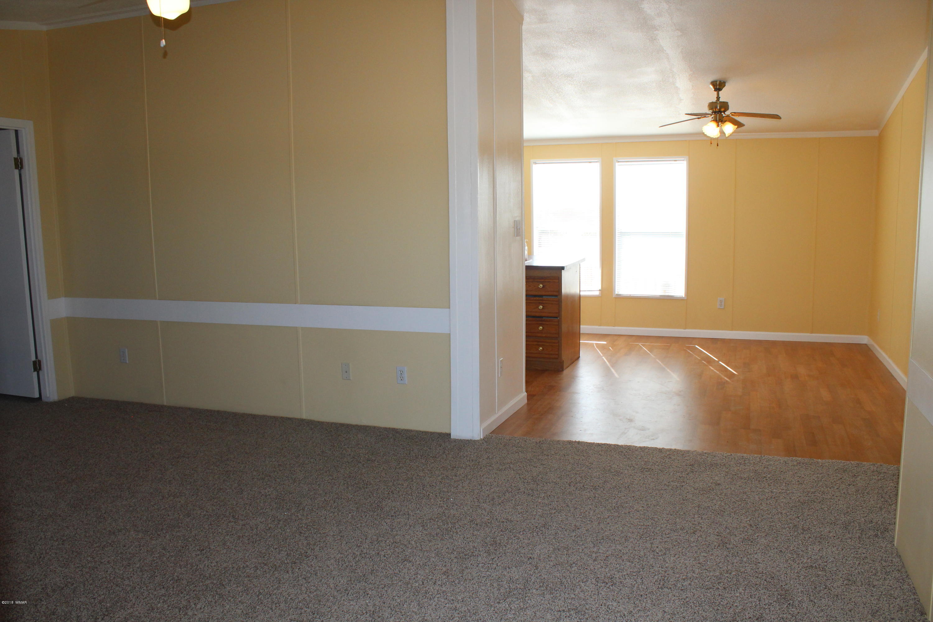 4714 Valley Road Snowflake, AZ 85937 - Photo 9 of 27 wooden floor in an empty room with a window