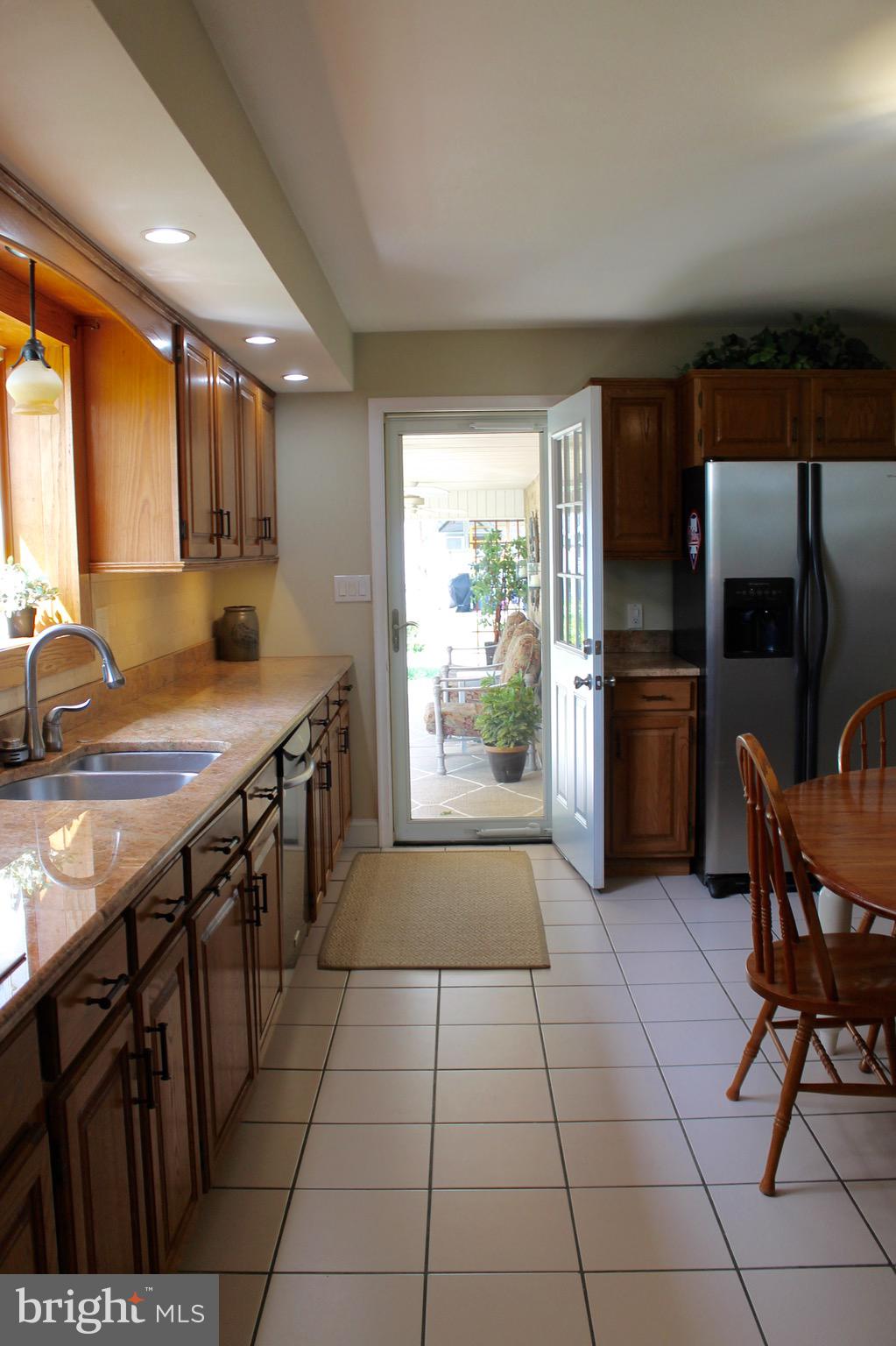 203 Lehigh Road South Glassboro, NJ 08028 - Photo 18 of 33 Access to back porch from kitchen