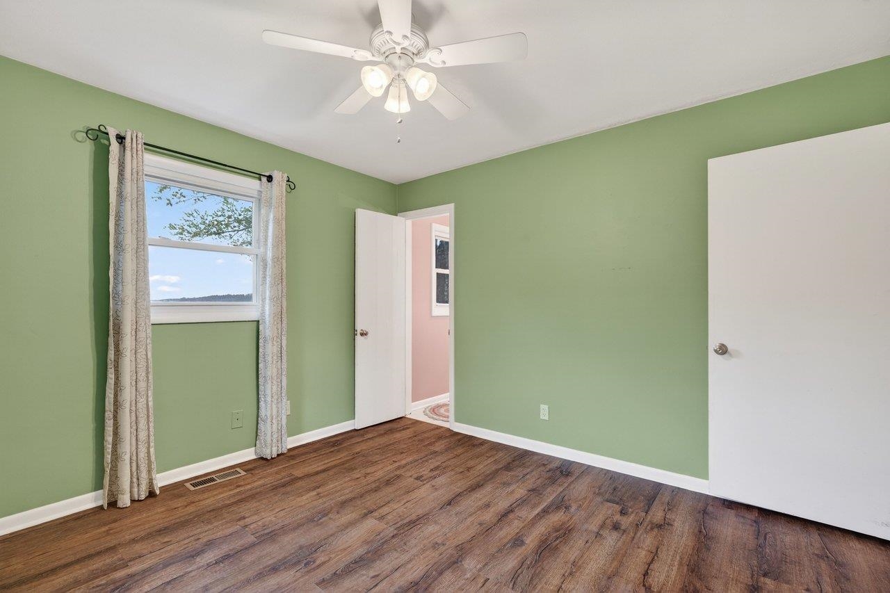 3259 Zion Church Road Broadway, VA 22815 - Photo 13 of 48 an empty room with wooden floor closet and windows