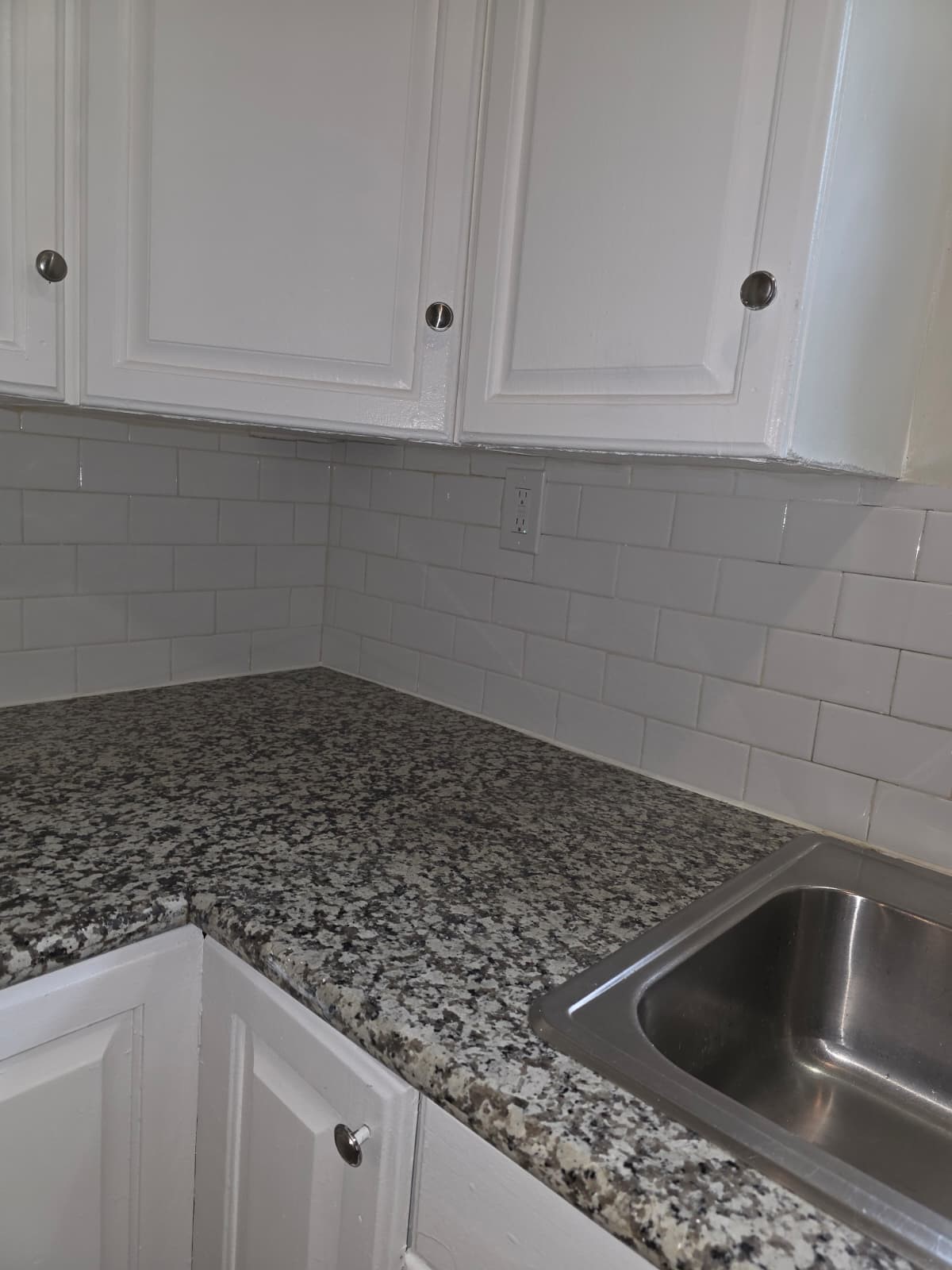 242 Bolden Street Houston, TX 77029 - Photo 8 of 24 a kitchen with white cabinets and a sink