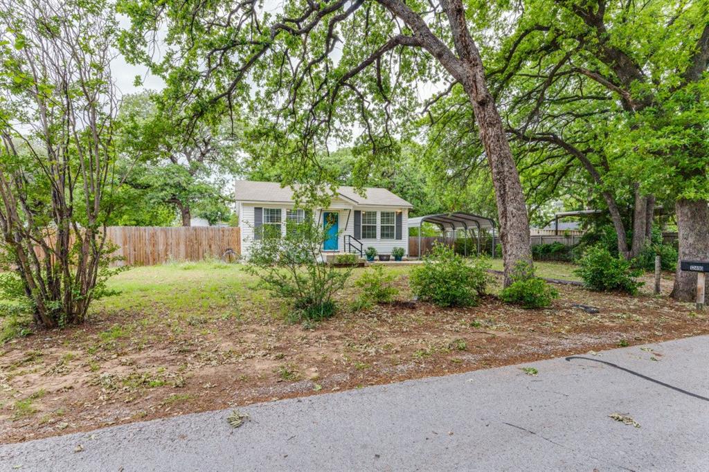 12490 Deeds Court Azle, TX 76020 - Photo 2 of 30 Side view of yard and house