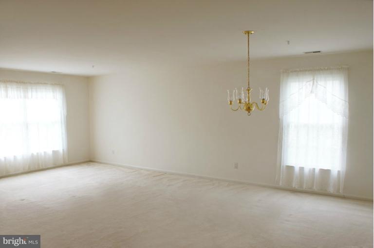 2614 Rigging Drive Annapolis, MD 21401 - Photo 15 of 27 Living Room Flowing into Dining Area