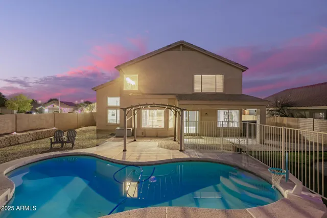 a front view of a house with a swimming pool