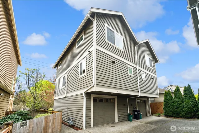 a front view of a house with a garage