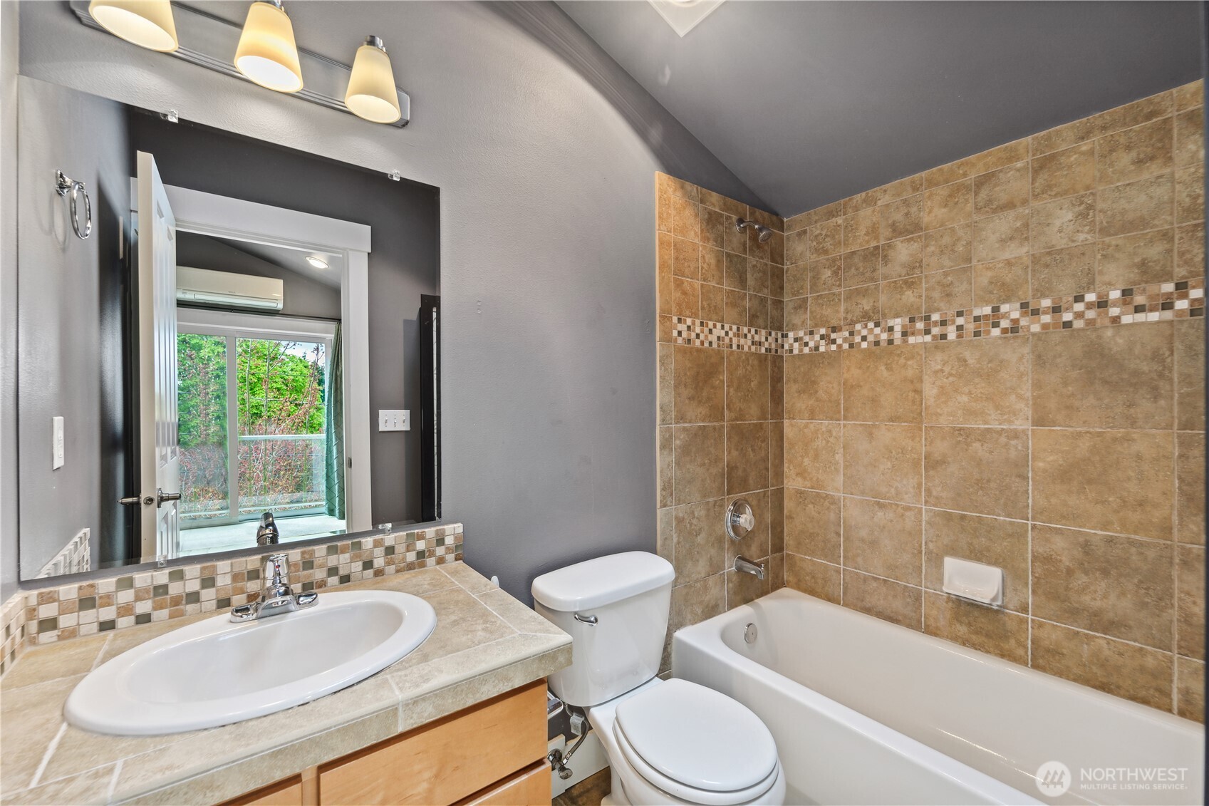 8403 8th Avenue Northwest, Unit B Seattle, WA 98117 - Photo 11 of 16 a bathroom with a sink a toilet and shower