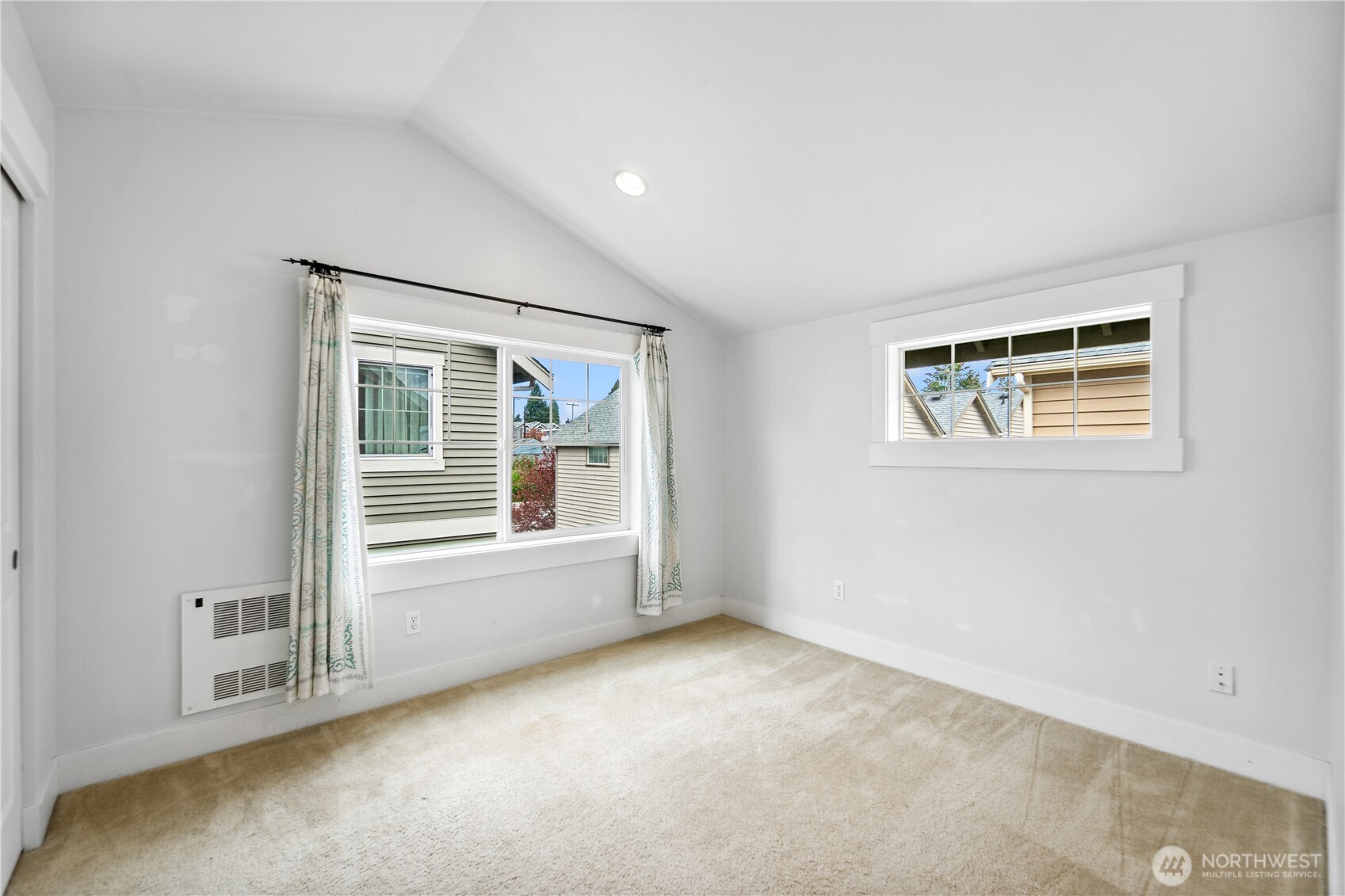 8403 8th Avenue Northwest, Unit B Seattle, WA 98117 - Photo 12 of 16 an empty room with windows