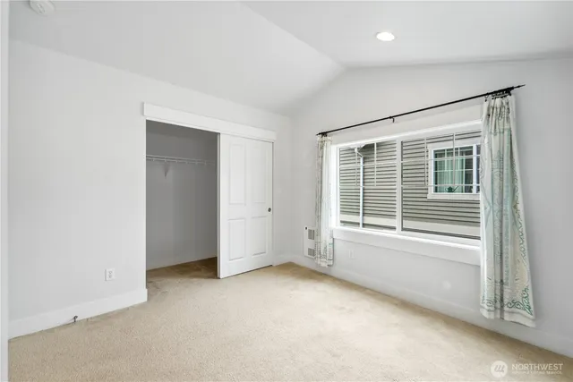 a bathroom with a sink a toilet a mirror a bathtub and shower