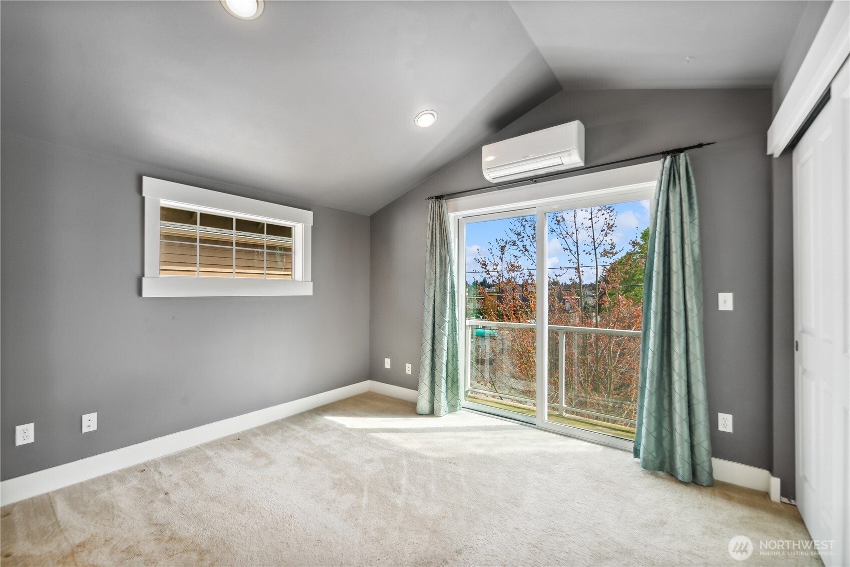 8403 8th Avenue Northwest, Unit B Seattle, WA 98117 - Photo 9 of 16 a view of an empty room with a window