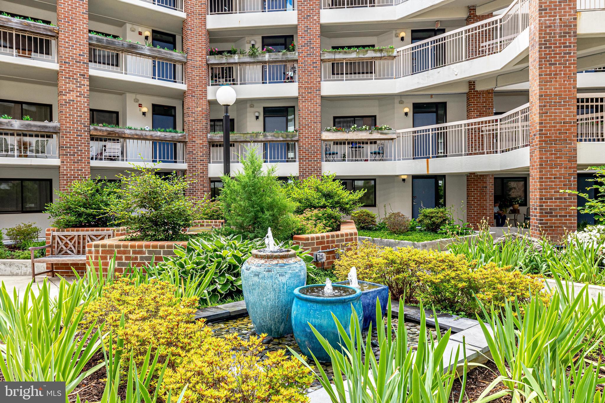 1951 Sagewood Lane, Unit 517 Reston, VA 20191 - Photo 46 of 50 Fun, decorative fountains in the courtyard.