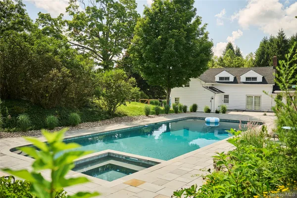 a view of a house with swimming pool