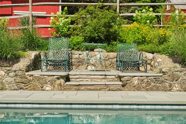 a view of swimming pool with a patio