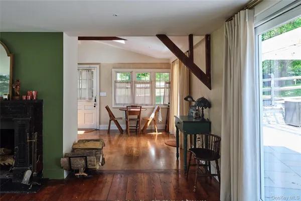 a dining room with furniture and wooden floor
