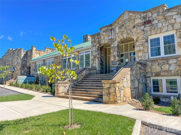 a view of a street with cars