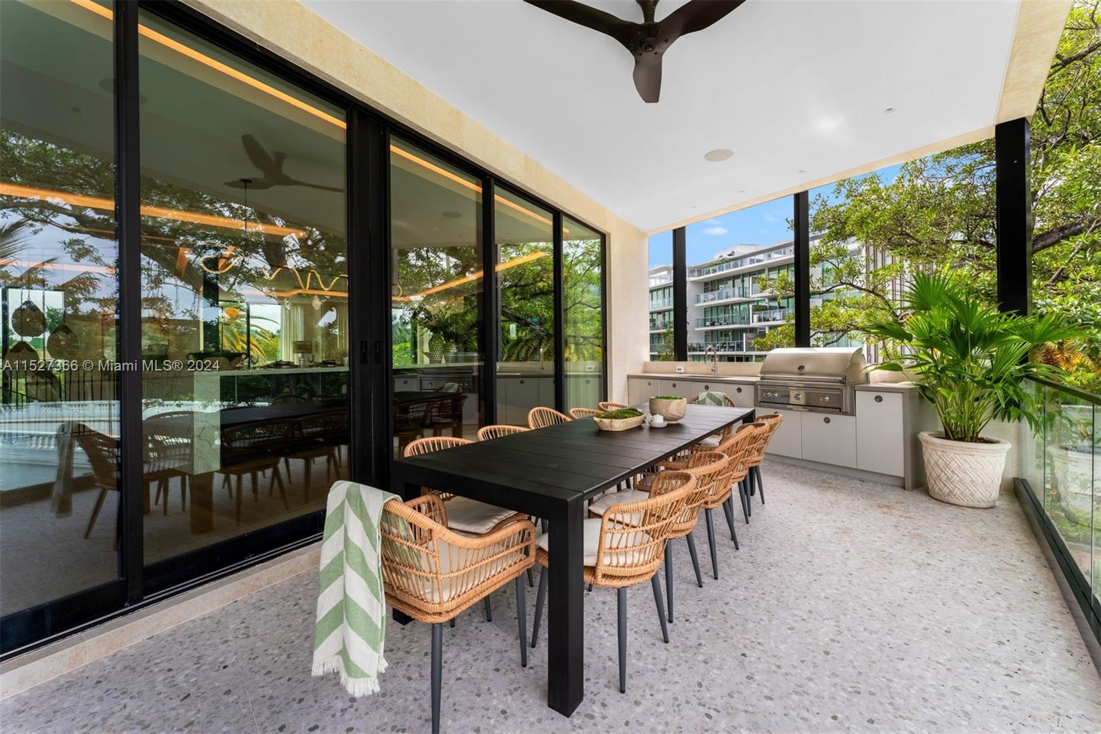 2000 North Bay Road Miami Beach, FL 33140 - Photo 30 of 62 a table and chairs in the patio