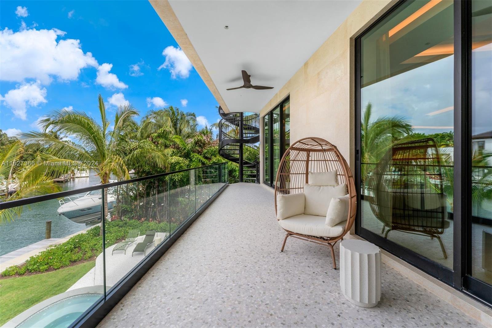 2000 North Bay Road Miami Beach, FL 33140 - Photo 31 of 62 a balcony with table and chairs