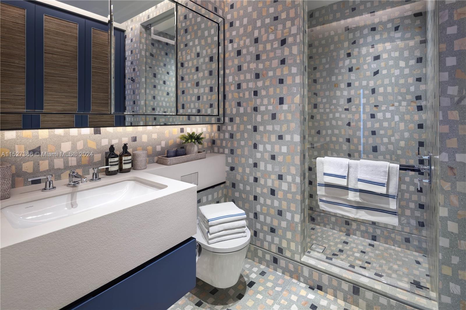 2000 North Bay Road Miami Beach, FL 33140 - Photo 39 of 62 a bathroom with a sink a toilet and shower
