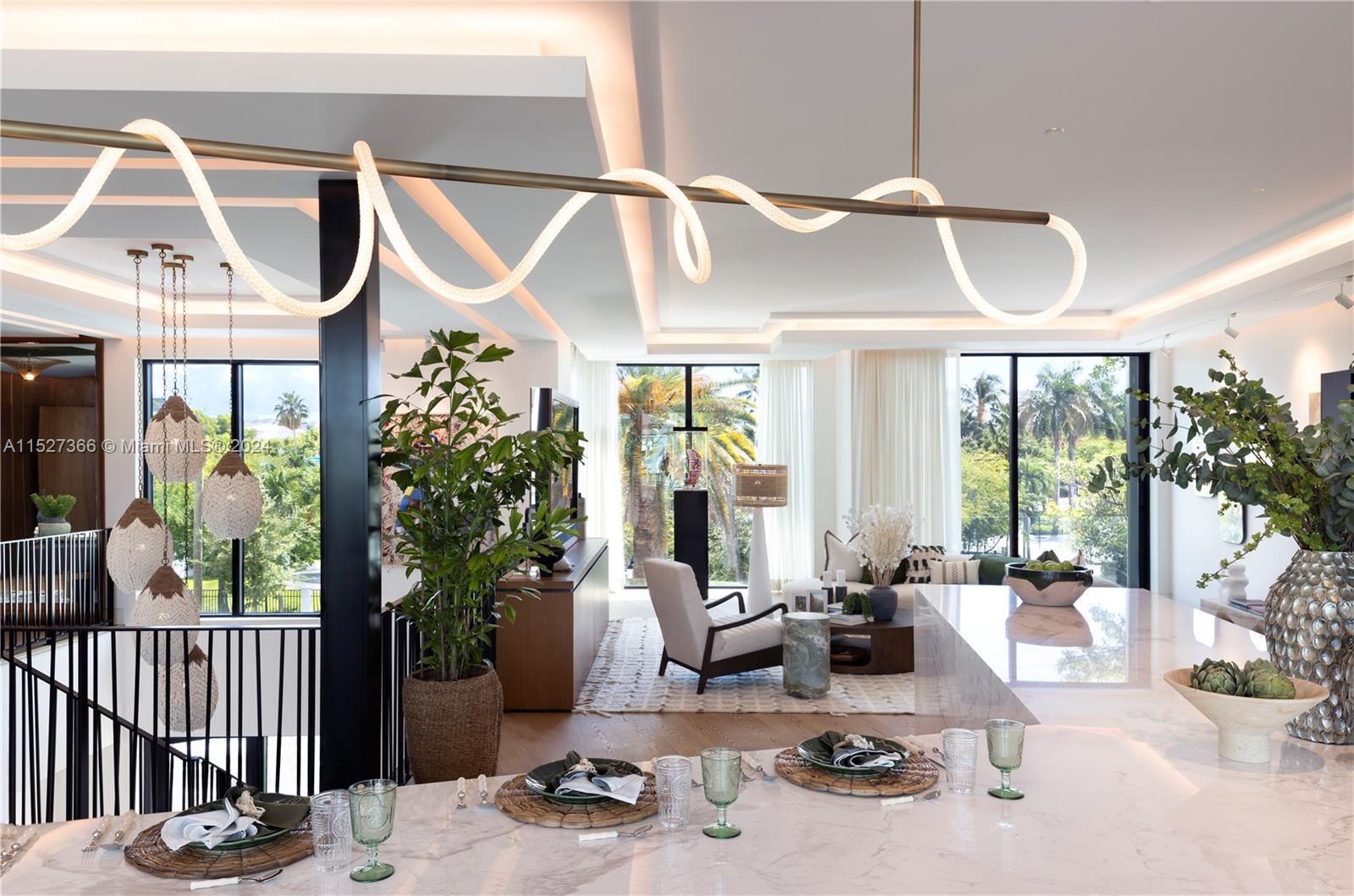 2000 North Bay Road Miami Beach, FL 33140 - Photo 4 of 62 a view of a livingroom with furniture and floor to ceiling windows