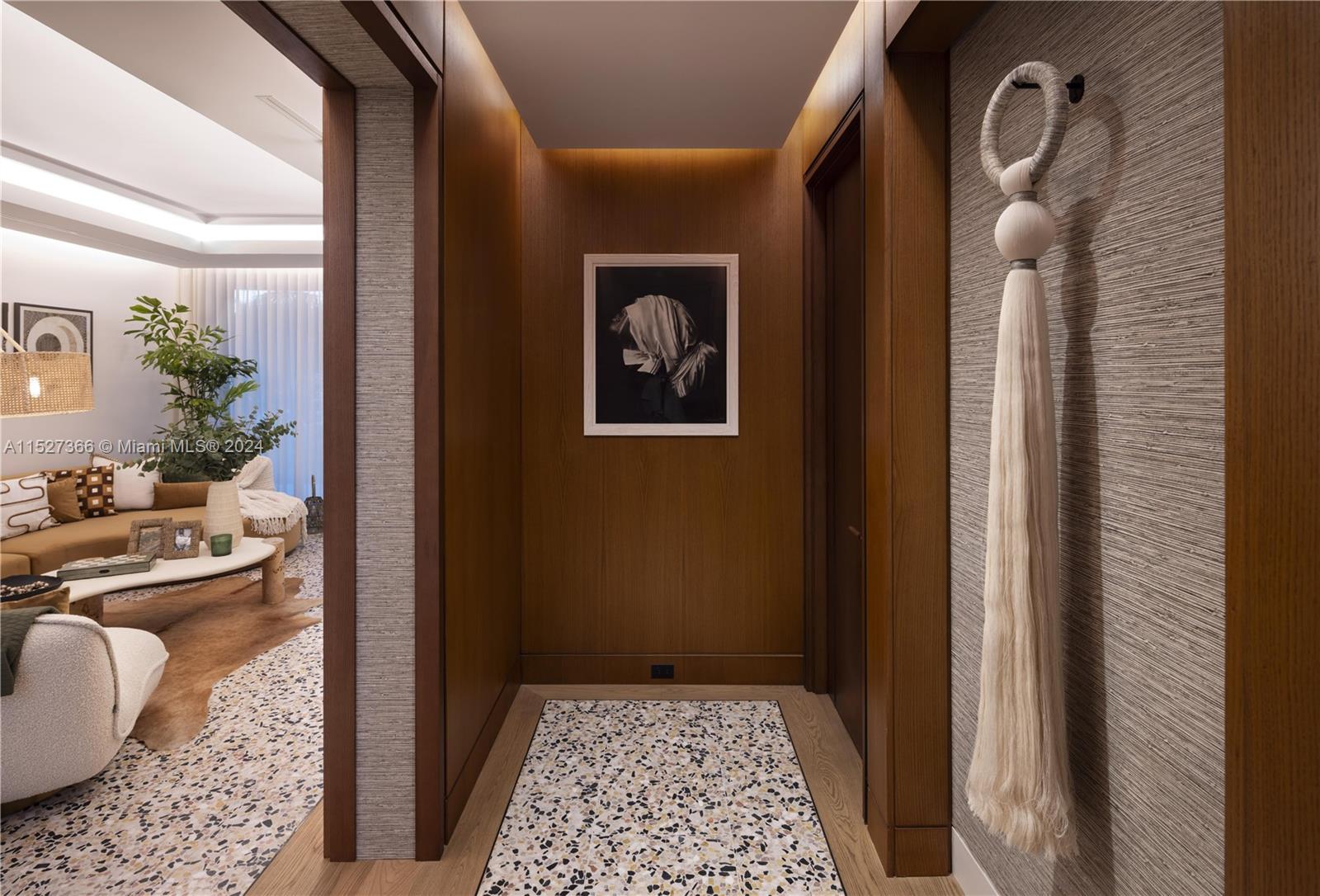 2000 North Bay Road Miami Beach, FL 33140 - Photo 46 of 62 a view of a hallway to a livingroom with furniture and windows