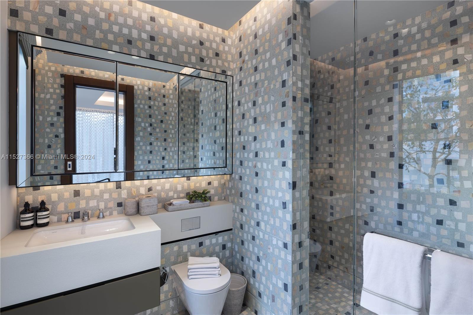 2000 North Bay Road Miami Beach, FL 33140 - Photo 50 of 62 a bathroom with a toilet a sink and a bathtub