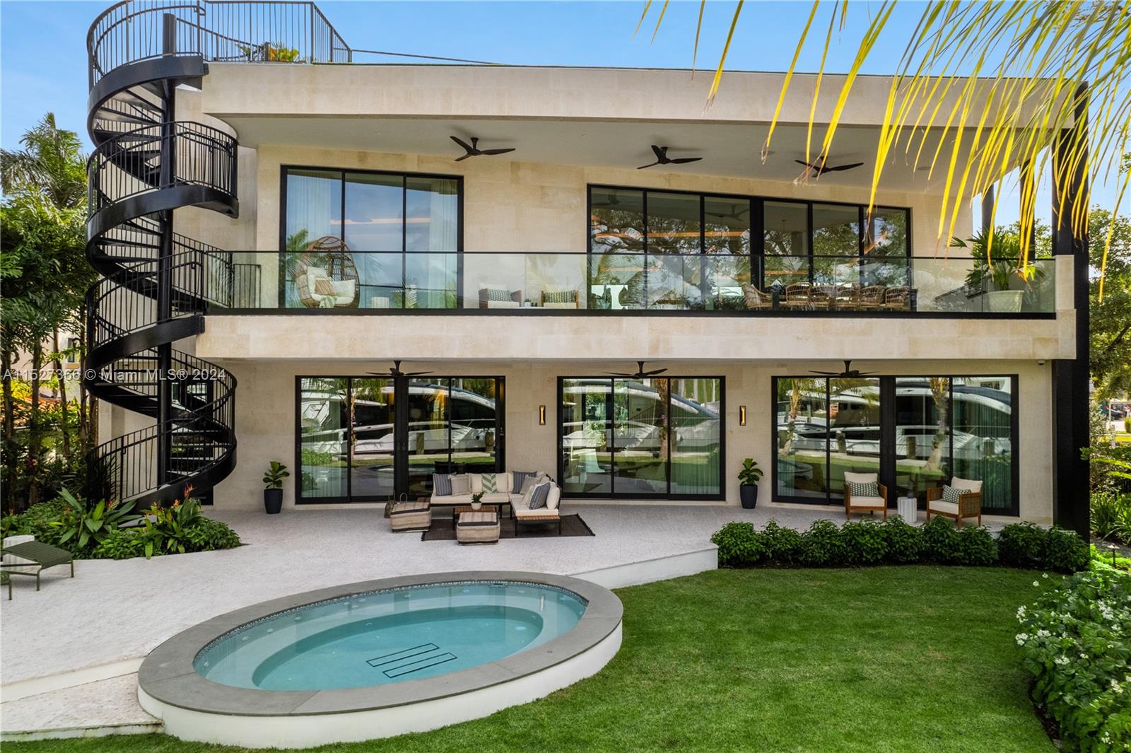 2000 North Bay Road Miami Beach, FL 33140 - Photo 56 of 62 a swimming pool view with a outdoor seating