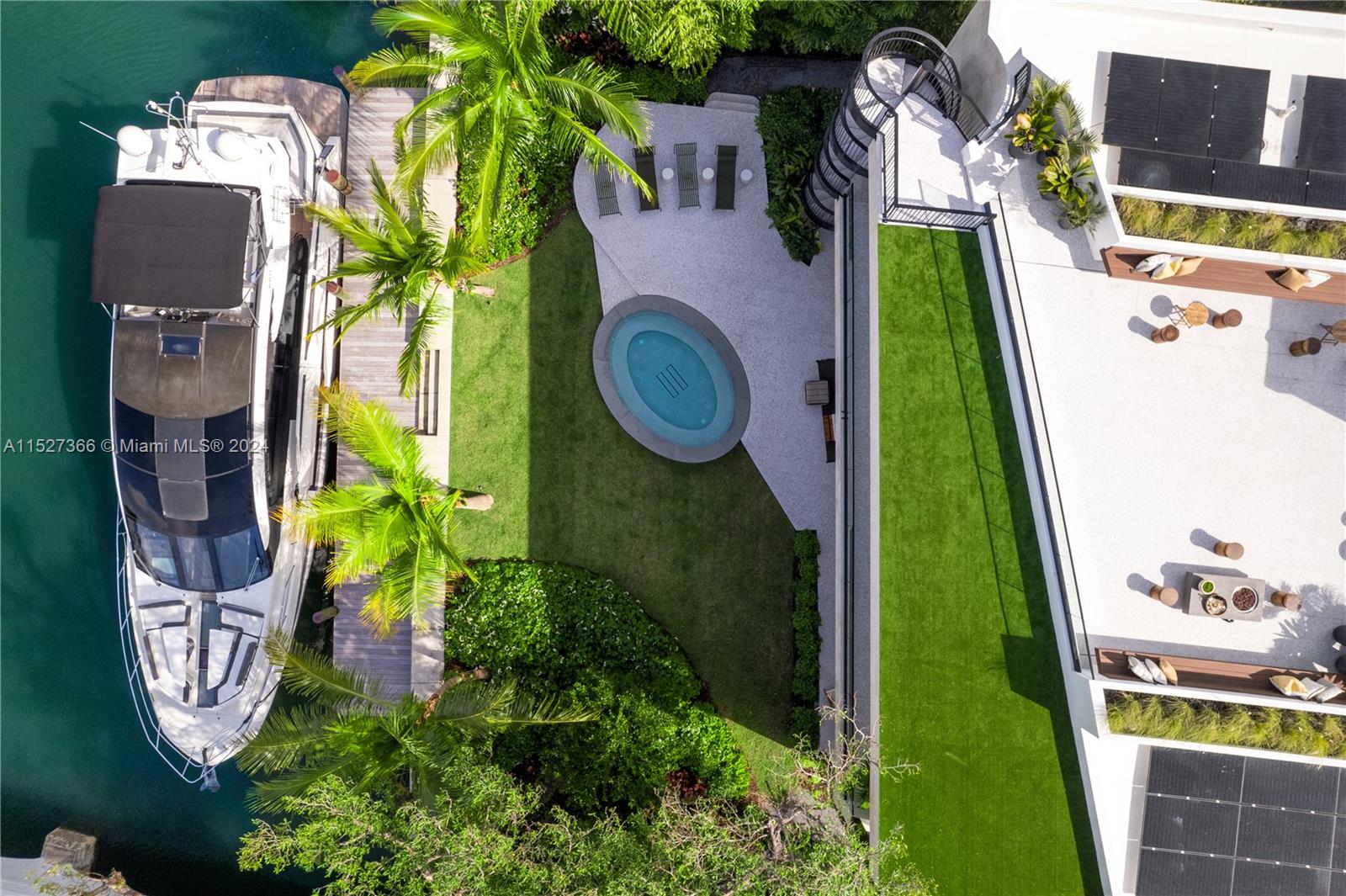 2000 North Bay Road Miami Beach, FL 33140 - Photo 59 of 62 an aerial view of a house with garden space and swimming pool