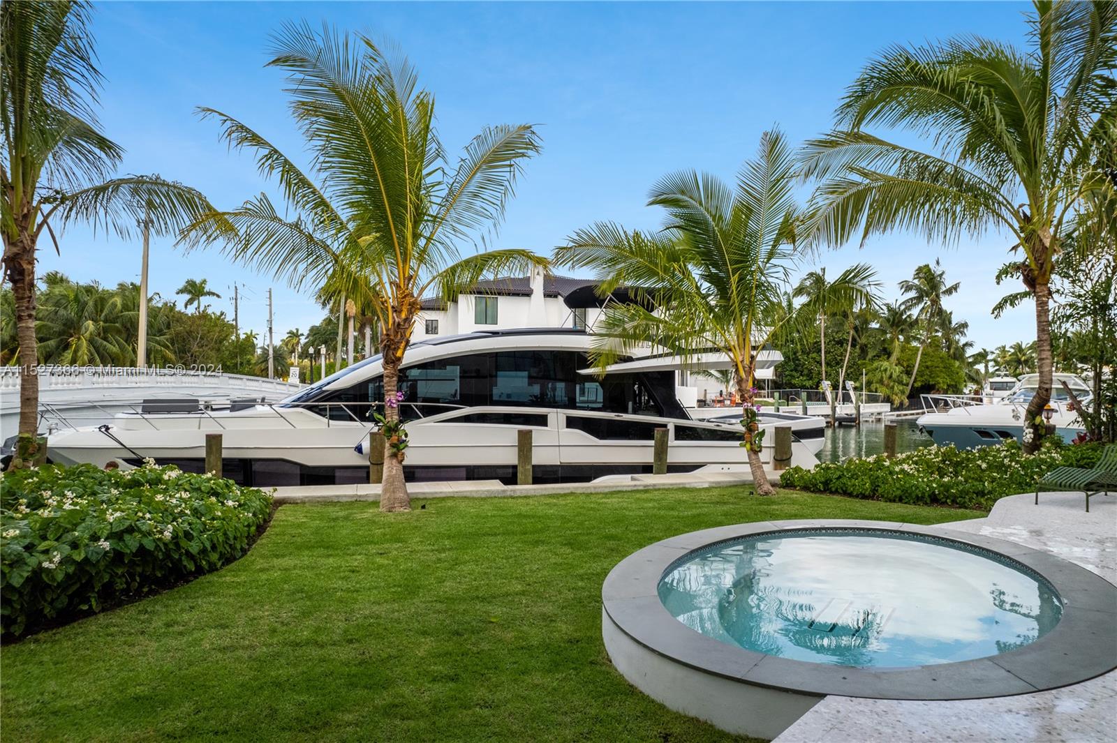 2000 North Bay Road Miami Beach, FL 33140 - Photo 60 of 62 a swimming pool with outdoor seating yard and barbeque oven