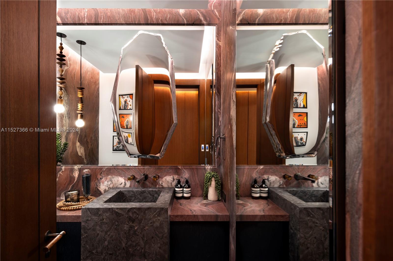 2000 North Bay Road Miami Beach, FL 33140 - Photo 10 of 62 a bathroom with a sink and a mirror