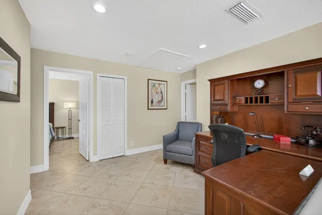 a bathroom with a granite countertop sink mirror and a bathtub