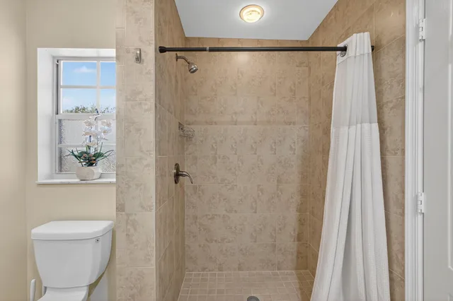 a kitchen with stainless steel appliances granite countertop a refrigerator stove and microwave