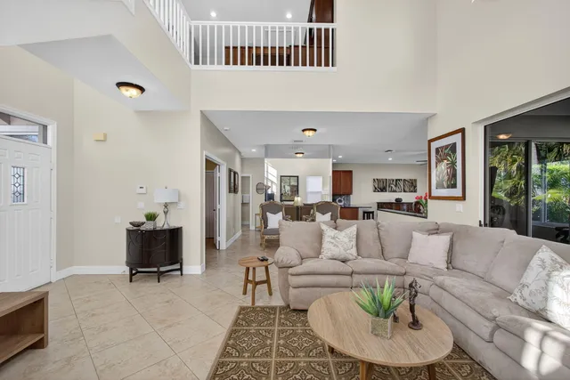 a view of a livingroom with furniture and a potted plant
