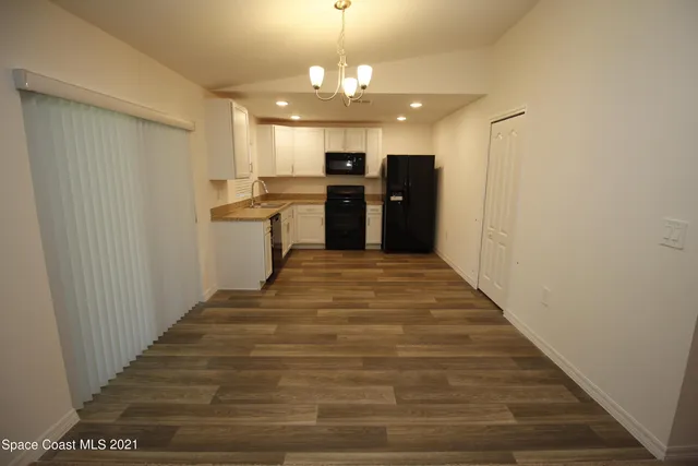 a view of a kitchen with a sink