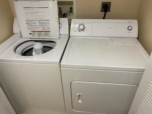a close up view of washer and dryer with washer and dryer