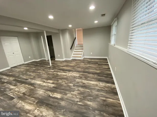 a view of a hallway with stairs