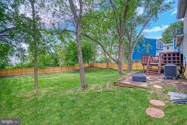 a view of a backyard with sitting area