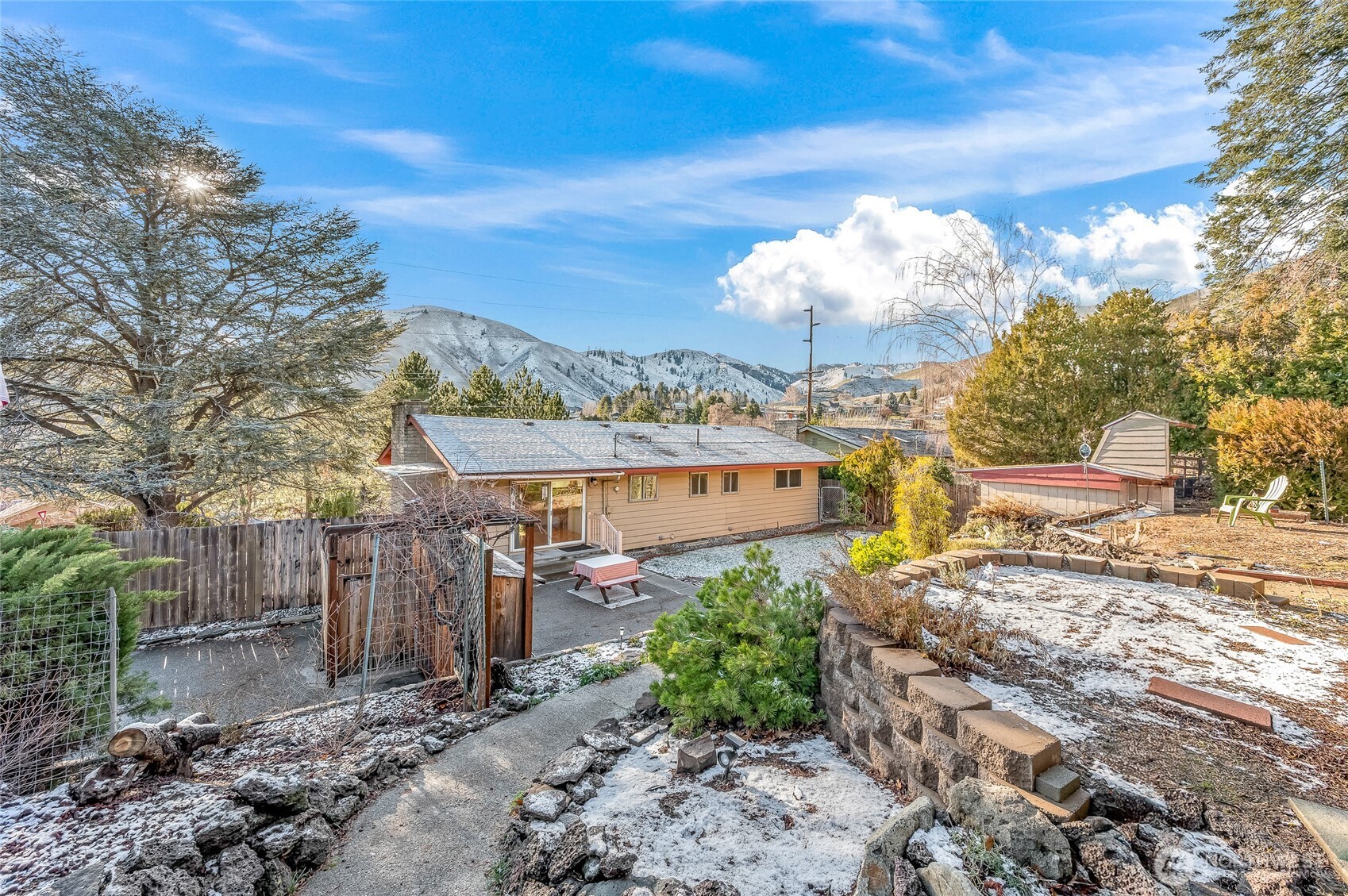 2314 Westwick Road Wenatchee, WA 98801 - Photo 28 of 37 a view of a backyard with plants and large trees
