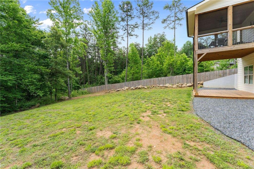 1300 Preacher Campbell Road Clarkesville, GA 30523 - Photo 28 of 34 a backyard of a house with lots of green space